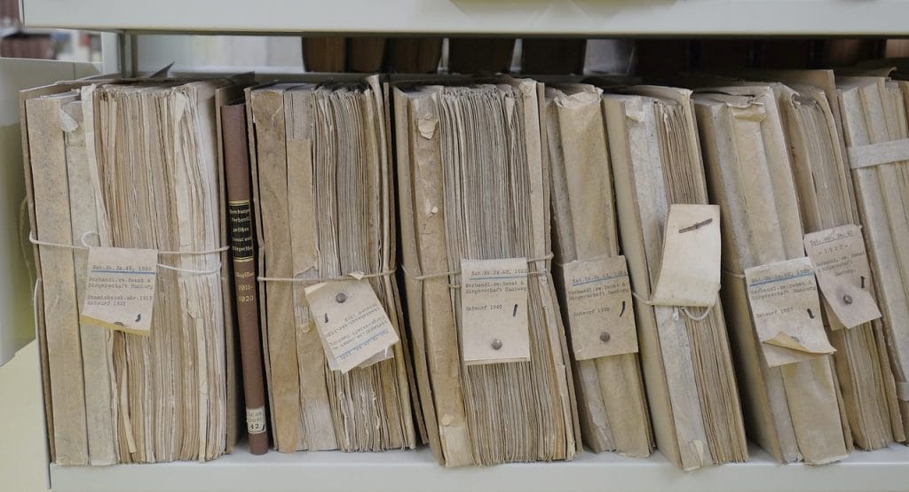 Close-up of aged financial records, tied and labeled, suggesting historical credit practices.