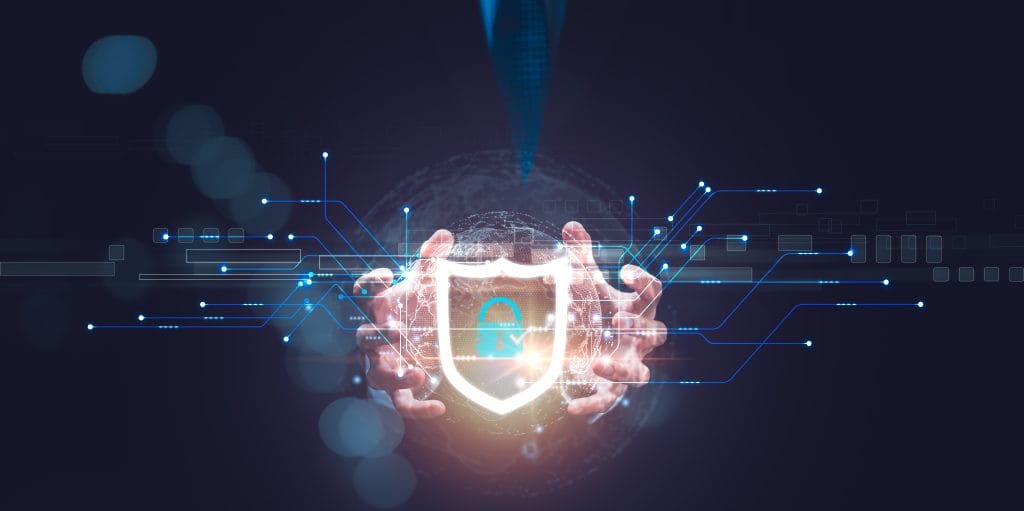 Hands holding a glowing digital shield with a lock icon, representing cybersecurity and data protection.